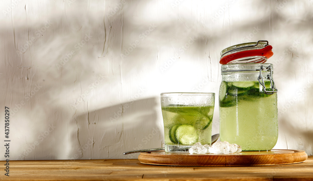 Fresh water with cucumber, drink for a hot summer day, healthy natural drink, an injection of vitamins Fresh water with cucumber, drink for a hot summer day, healthy natural drink, an injection of vitamins