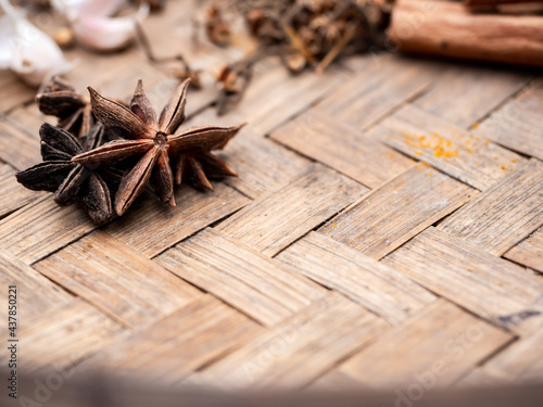 Top view of colourful spices in wooden tray. Asian popular cooking ingredients, dry hot healthy cook herbs. view form above and copy space background. photo