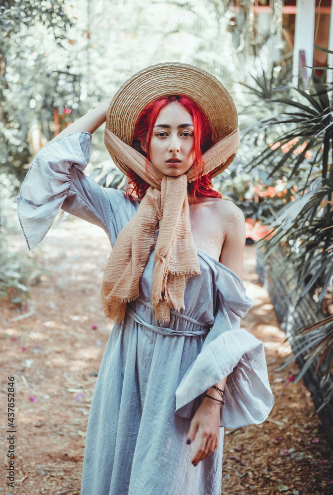 Beautiful young girl posing on the street in a gray long dress with red and pink hair, Asian woman, tender tanned skin, portrait, sweetheart, lips, smile, retro styле, cap, hat, Thailand, scarf, 