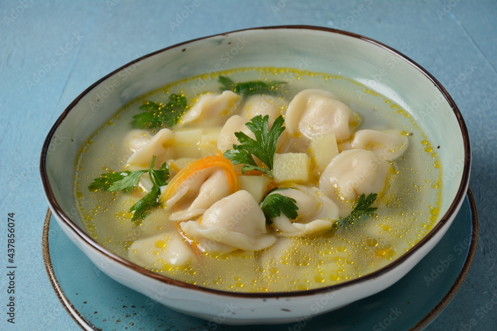 Soup with pelmeni (russian dumplings). Soup with meat dumplings, potatoes and other vegetables Soup with pelmeni (russian dumplings). Soup with meat dumplings, potatoes and other vegetables