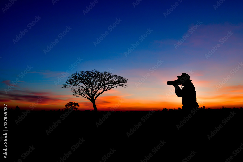 silhouette of a person watching the sunset