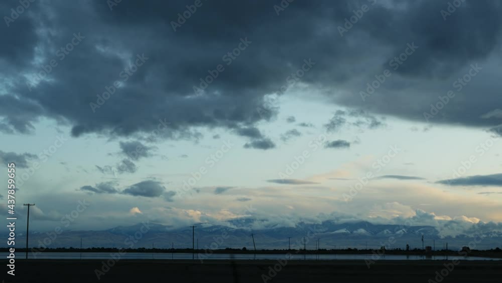 Driving auto, road trip in California, USA, view from car. Hitchhiking traveling in United States. Highway, mountains and cloudy dramatic sky before rain storm. American scenic byway. Passenger POV. Driving auto, road trip in California, USA, view from car. Hitchhiking traveling in United States. Highway, mountains and cloudy dramatic sky before rain storm. American scenic byway. Passenger POV.