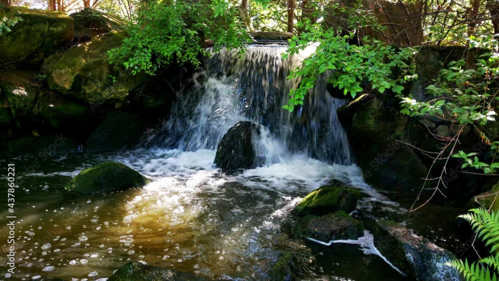A small waterfall with cold clear mountain water A small waterfall with cold clear mountain water