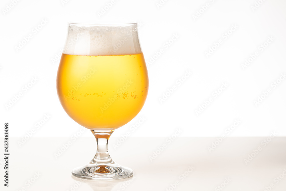 Glass of cold golden beer isolated on a white background Glass of cold golden beer isolated on a white background