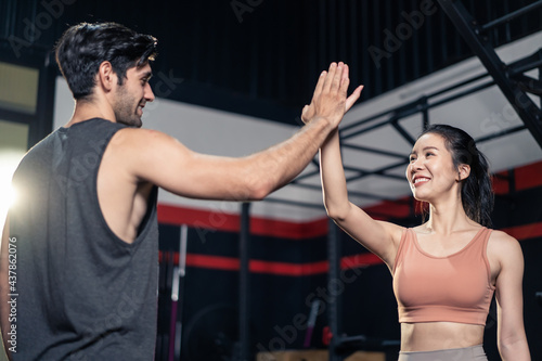 Sport athlete friend give high five before exercise at fitness stadium 