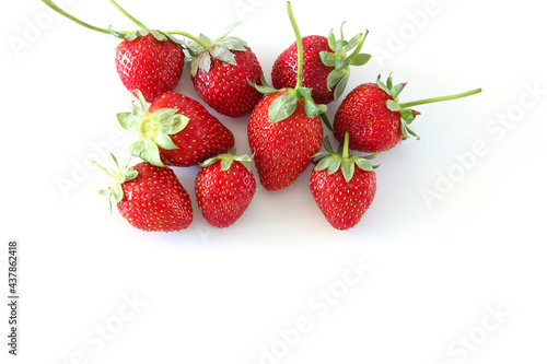 Fresh red organic strawberries isolated on white background. Top view, copy space.