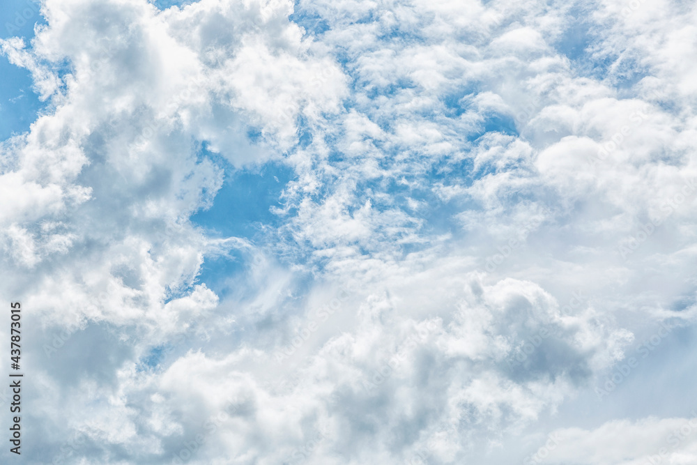 Blue cloudy sky on a sunny day. Space for text. Background.