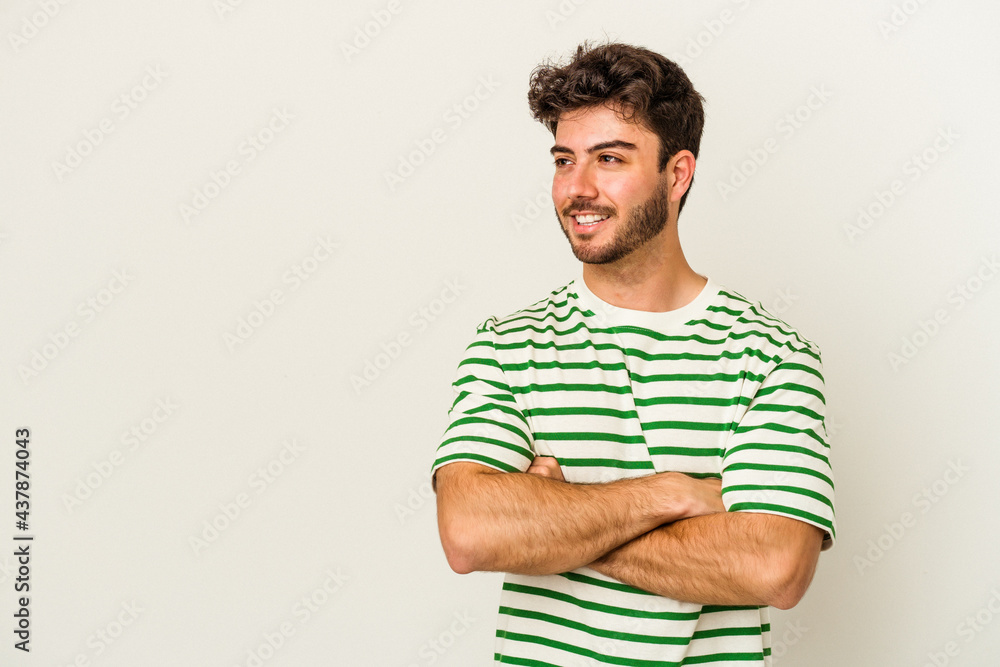 Young caucasian man isolated on white background smiling confident with crossed arms. Young caucasian man isolated on white background smiling confident with crossed arms.