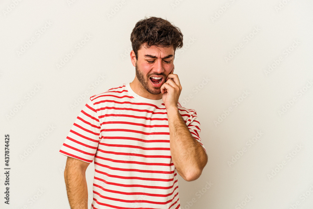 Young caucasian man isolated on white background having a strong teeth pain, molar ache. Young caucasian man isolated on white background having a strong teeth pain, molar ache.