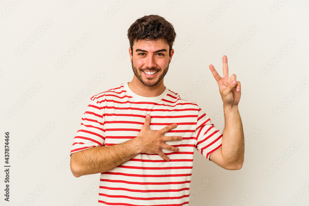 Young caucasian man isolated on white background taking an oath, putting hand on chest. Young caucasian man isolated on white background taking an oath, putting hand on chest.