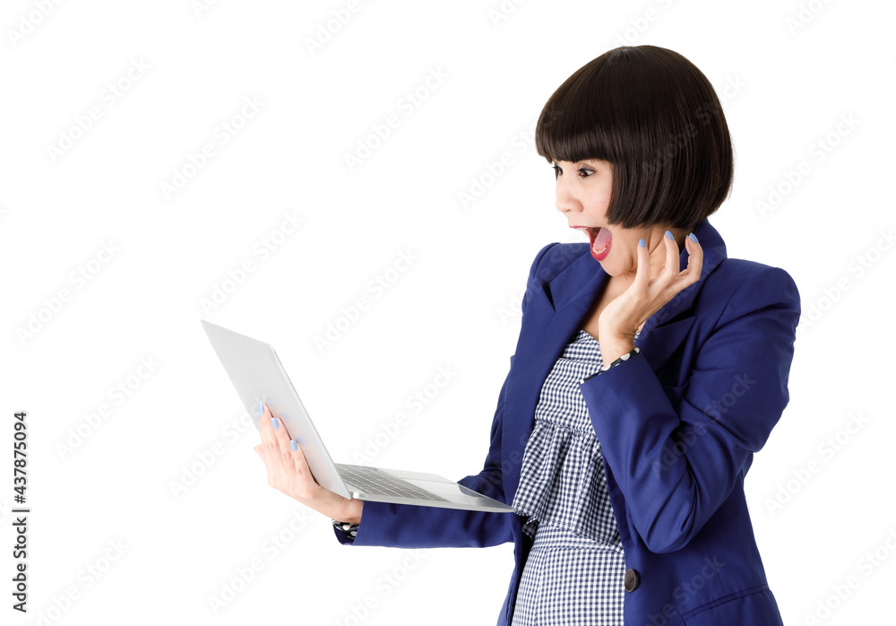 Stunned Asian woman looking at laptop screen Stunned Asian woman looking at laptop screen