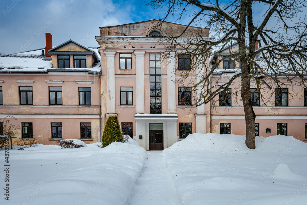 Path leads through the snowy park to the manor. Cere Manor, Latvia. The Cēre primary school is located in the manor house. Path leads through the snowy park to the manor. Cere Manor, Latvia. The Cēre primary school is located in the manor house.