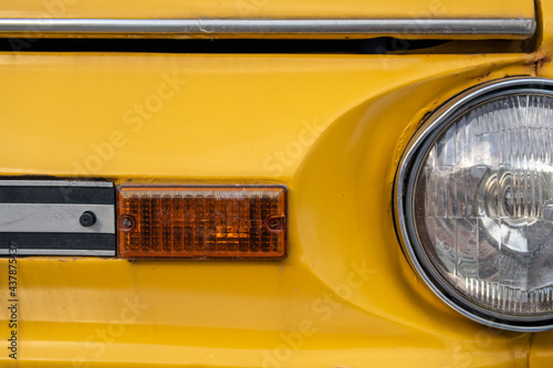 Car element. Headlamp. Yellow car