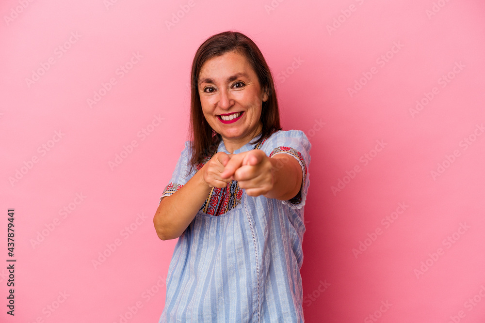 Middle age caucasian woman isolated on pink background cheerful smiles pointing to front. Middle age caucasian woman isolated on pink background cheerful smiles pointing to front.