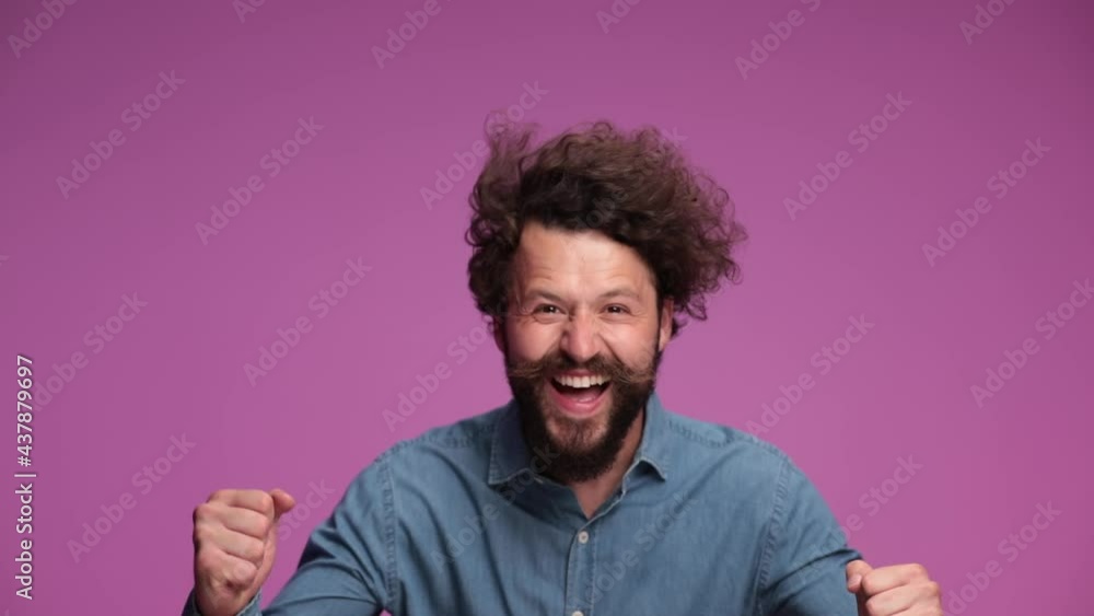 attractive casual man celebrating success, clapping his hands and cheering attractive casual man celebrating success, clapping his hands and cheering