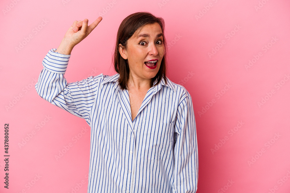 Middle age caucasian woman isolated on pink background having some great idea, concept of creativity. Middle age caucasian woman isolated on pink background having some great idea, concept of creativity.