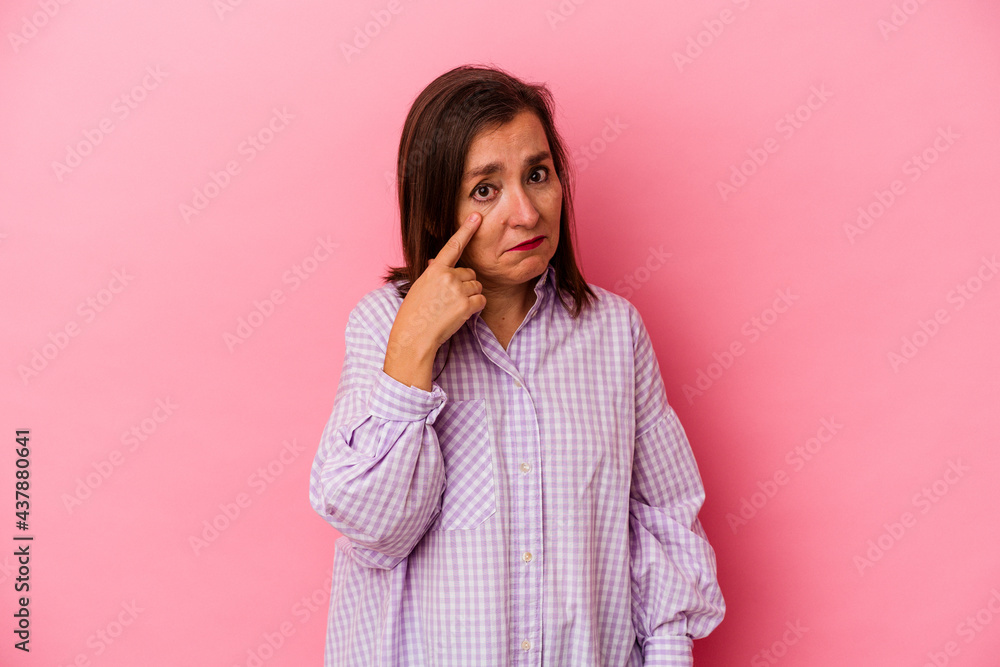 Middle age caucasian woman isolated on pink background crying, unhappy with something, agony and confusion concept. Middle age caucasian woman isolated on pink background crying, unhappy with something, agony and confusion concept.