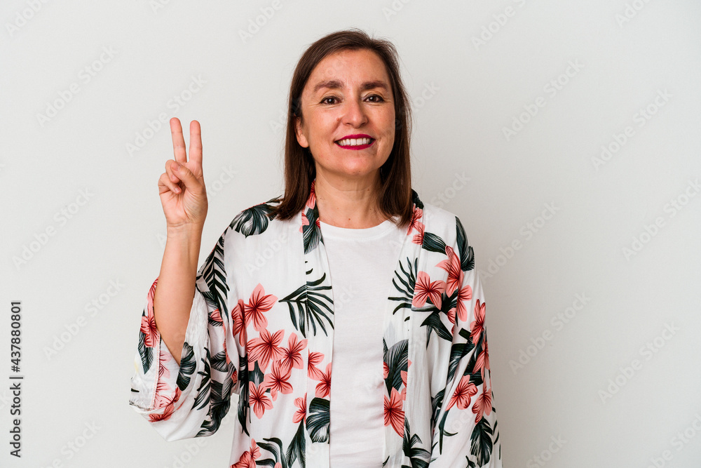 Middle age caucasian woman isolated on white background showing victory sign and smiling broadly. Middle age caucasian woman isolated on white background showing victory sign and smiling broadly.