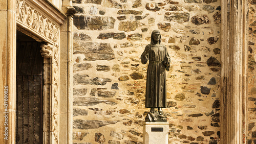 Statue of Saint Francis of Asissi at the gates of the Franciscan monastery of Guadalupe in Caceres, Spain. photo