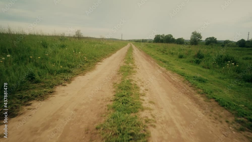 POV shot, moving along the rural field pathway in summer POV shot, moving along the rural field pathway in summer