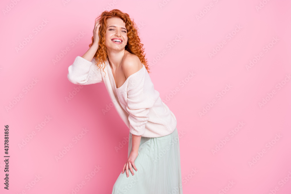 Photo portrait of red haired curly woman laughing in glamour outfit isolated on pastel pink color background Photo portrait of red haired curly woman laughing in glamour outfit isolated on pastel pink color background