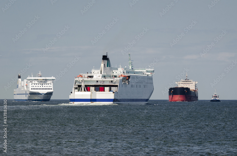 MARITIME TRANSPORT  - Passenger ferrys and bulk carrier on waterway to the port 