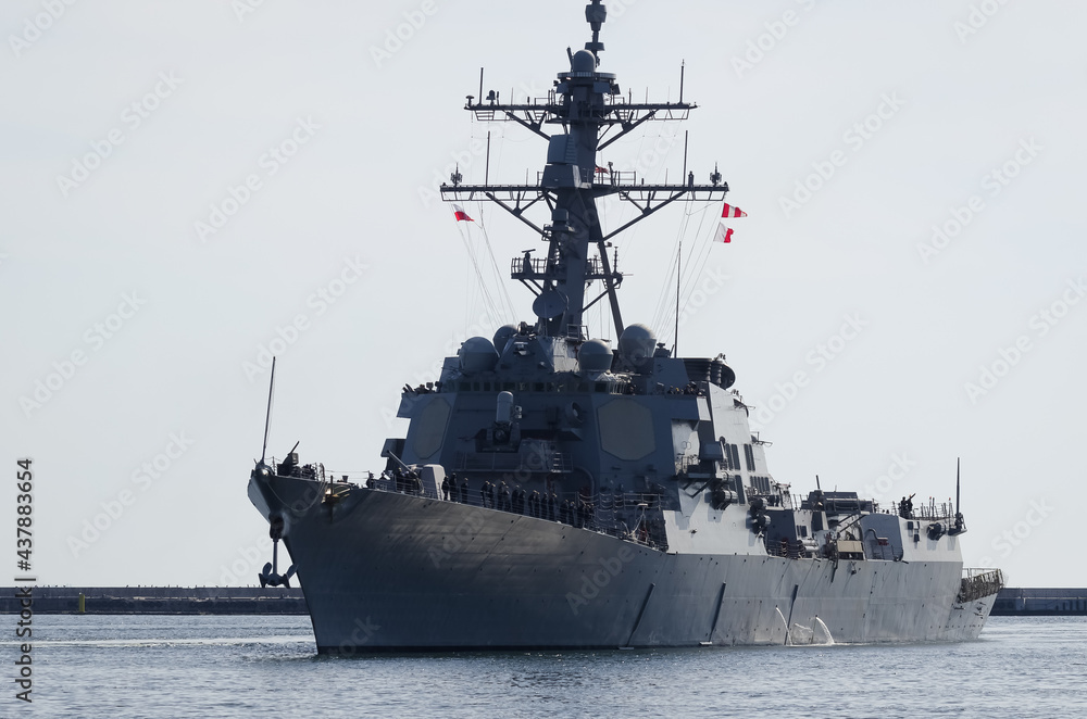 WARSHIP - Guided missile destroyer is maneuvering in the port WARSHIP - Guided missile destroyer is maneuvering in the port