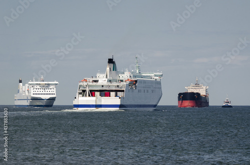 MARITIME TRANSPORT  - Passenger ferrys and bulk carrier on waterway to the port 