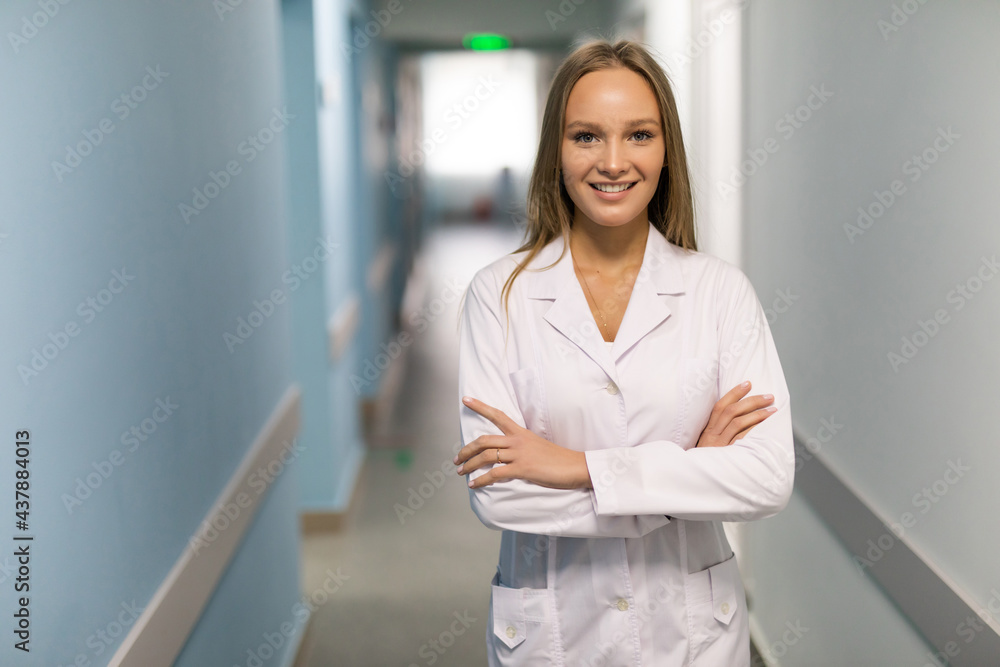 Grave looking woman doctor in a hospital interior Grave looking woman doctor in a hospital interior