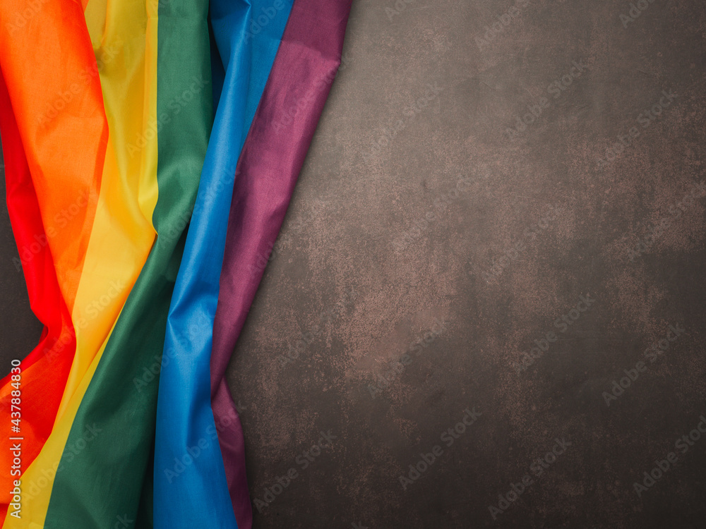 Top view of the rainbow flag (LGBT) on vintage background. Top view. Flat lay. Space for text. Love concept