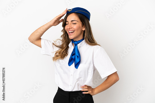 Airplane stewardess over isolated white background has realized something and intending the solution © luismolinero
