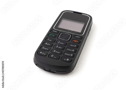 Old and outdated mobile phone isolated on white background.