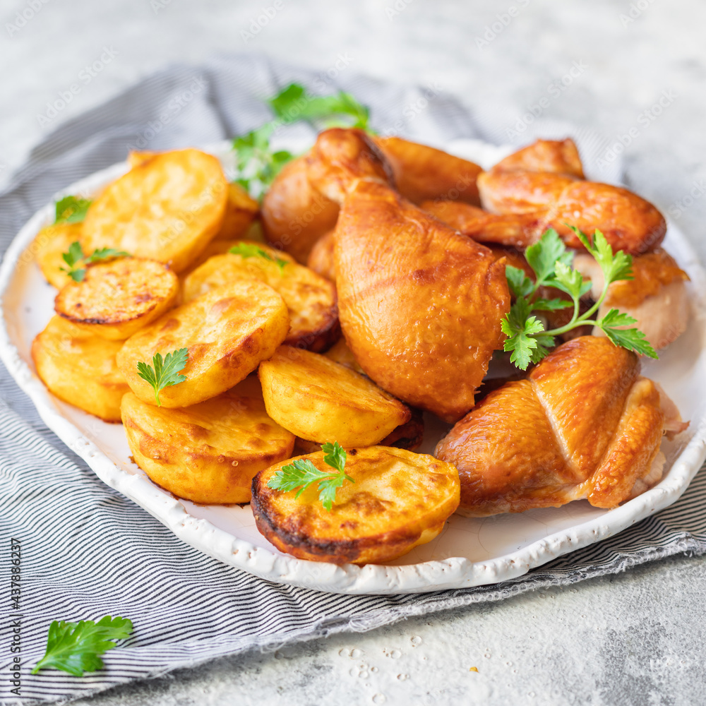 chicken pieces and potatoes fried , baked vegetable poultry meat organic dish on the table healthy food meal snack copy space food background rustic chicken pieces and potatoes fried , baked vegetable poultry meat organic dish on the table healthy food meal snack copy space food background rustic