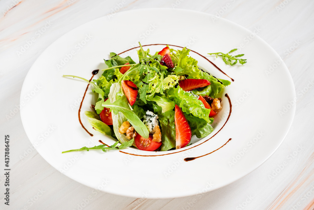healthy salad with strawberriesa and arugula healthy salad with strawberriesa and arugula