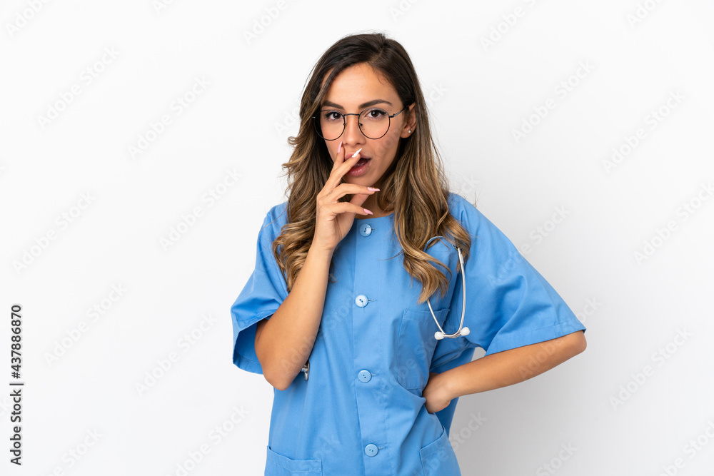 Young surgeon doctor woman over isolated white wall surprised and shocked while looking right Young surgeon doctor woman over isolated white wall surprised and shocked while looking right