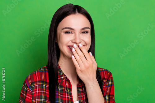 Photo of funny millennial lady close lips wear red shirt isolated on green color background