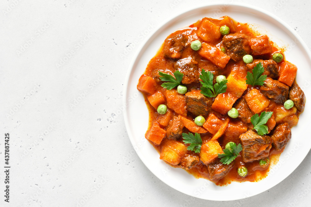 Beef stew with potatoes and carrots in tomato sauce Beef stew with potatoes and carrots in tomato sauce