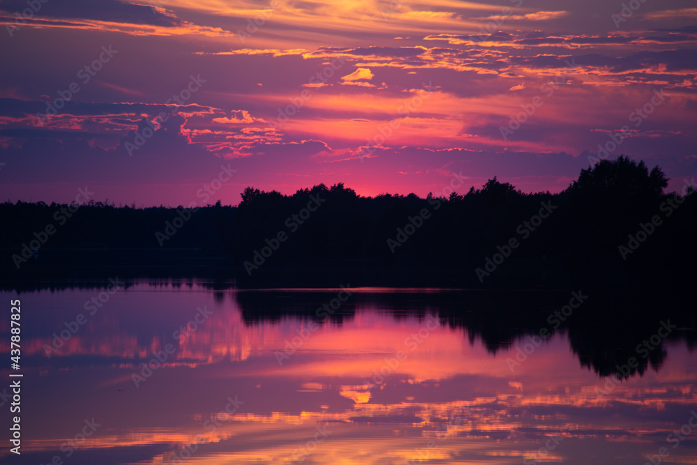 Sunset and its reflection on the water surface of the river. Sunset and its reflection on the water surface of the river.