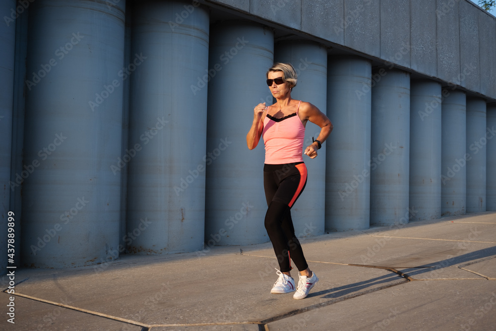 active seniors woman running in the city active seniors woman running in the city