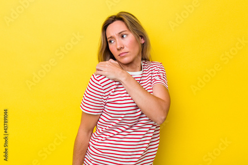 Young australian woman isolated having a shoulder pain.