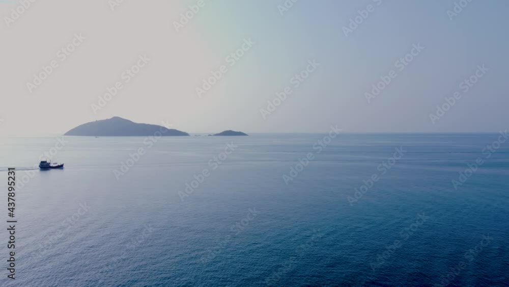 The lonely fishing boat is carving the sea. The lonely fishing boat is carving the sea.