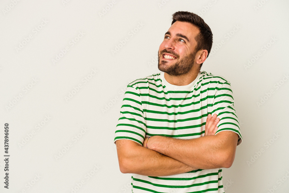 Young caucasian man isolated on white background smiling confident with crossed arms. Young caucasian man isolated on white background smiling confident with crossed arms.