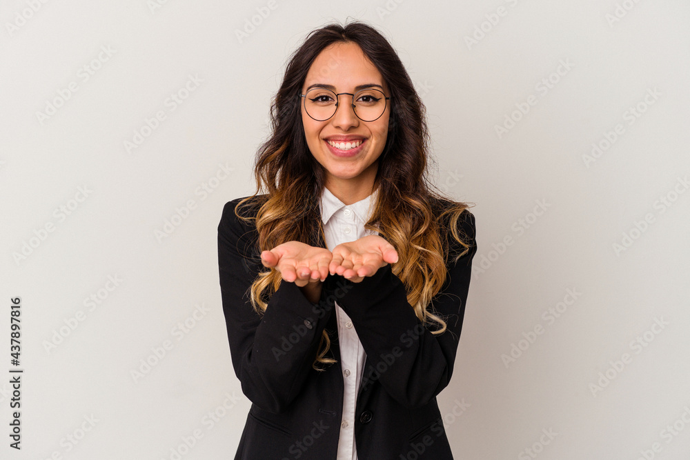 Young mexican business woman isolated on white background holding something with palms, offering to camera. Young mexican business woman isolated on white background holding something with palms, offering to camera.
