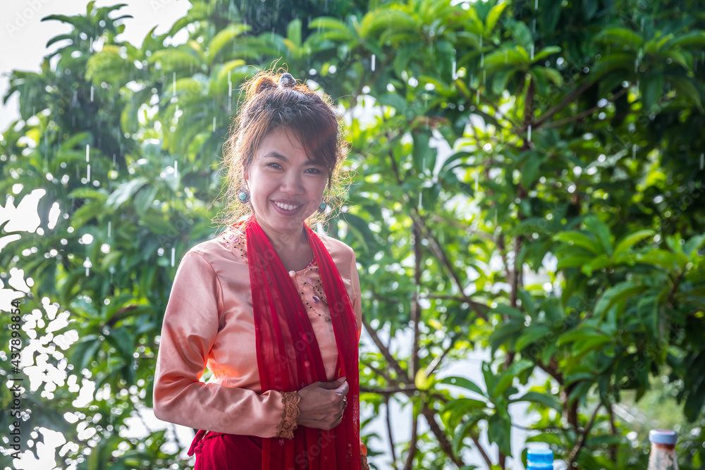 Thai women get dress traditional costume of Mon tribal at Mon village, Sangkhlaburi, Kanchanaburi, Thailand. Thai women get dress traditional costume of Mon tribal at Mon village, Sangkhlaburi, Kanchanaburi, Thailand.