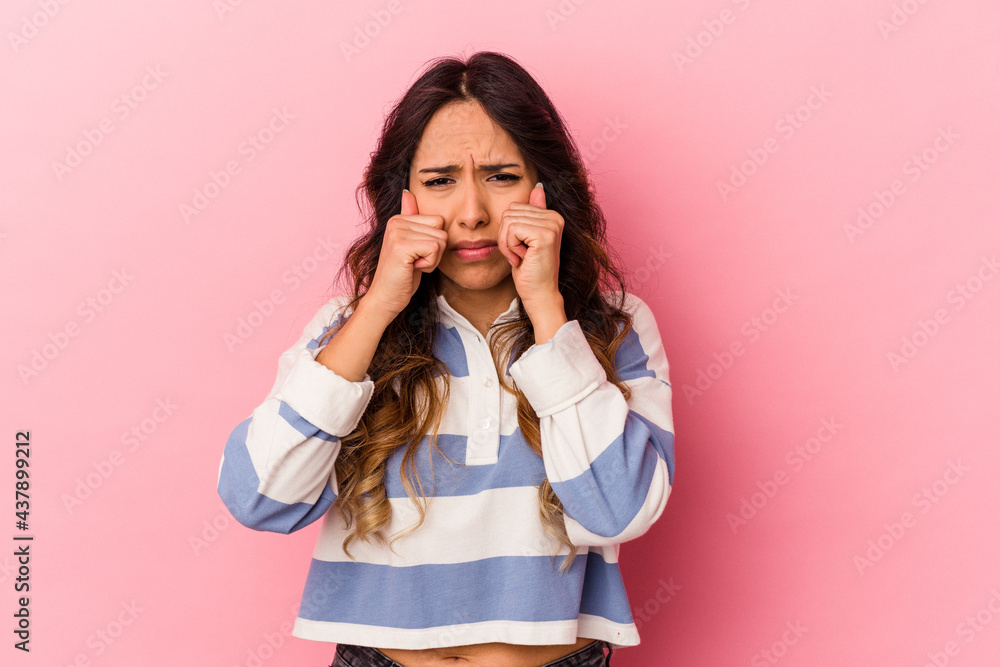 Young mexican woman isolated on pink background whining and crying disconsolately. Young mexican woman isolated on pink background whining and crying disconsolately.