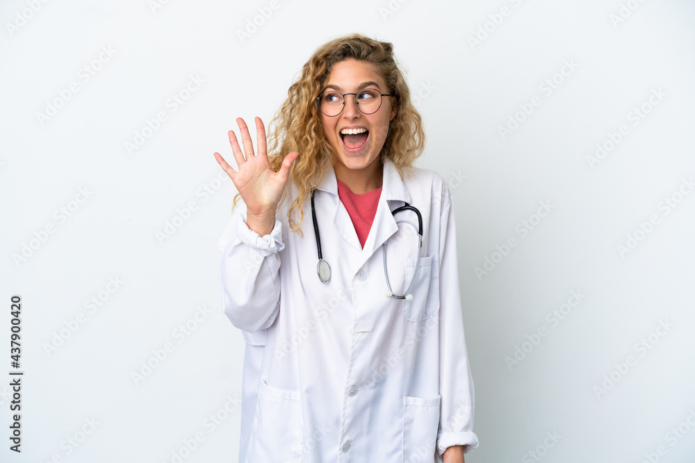 Young doctor blonde woman isolated on white background counting five with fingers Young doctor blonde woman isolated on white background counting five with fingers