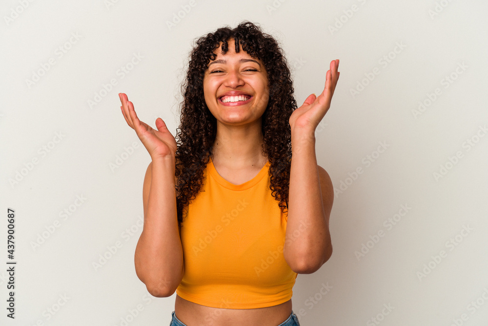 Young mixed race woman isolated on white background joyful laughing a lot. Happiness concept. Young mixed race woman isolated on white background joyful laughing a lot. Happiness concept.