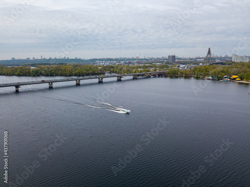 Motor boat with water skis on the river. Aerial drone view.