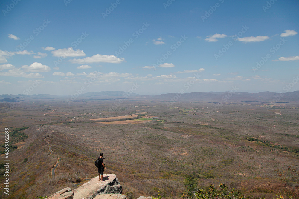 alone man on the top of mountain