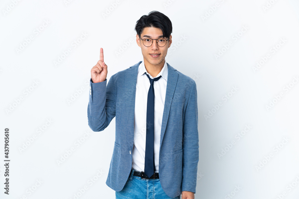 Young Chinese business man isolated on white background pointing up a great idea Young Chinese business man isolated on white background pointing up a great idea